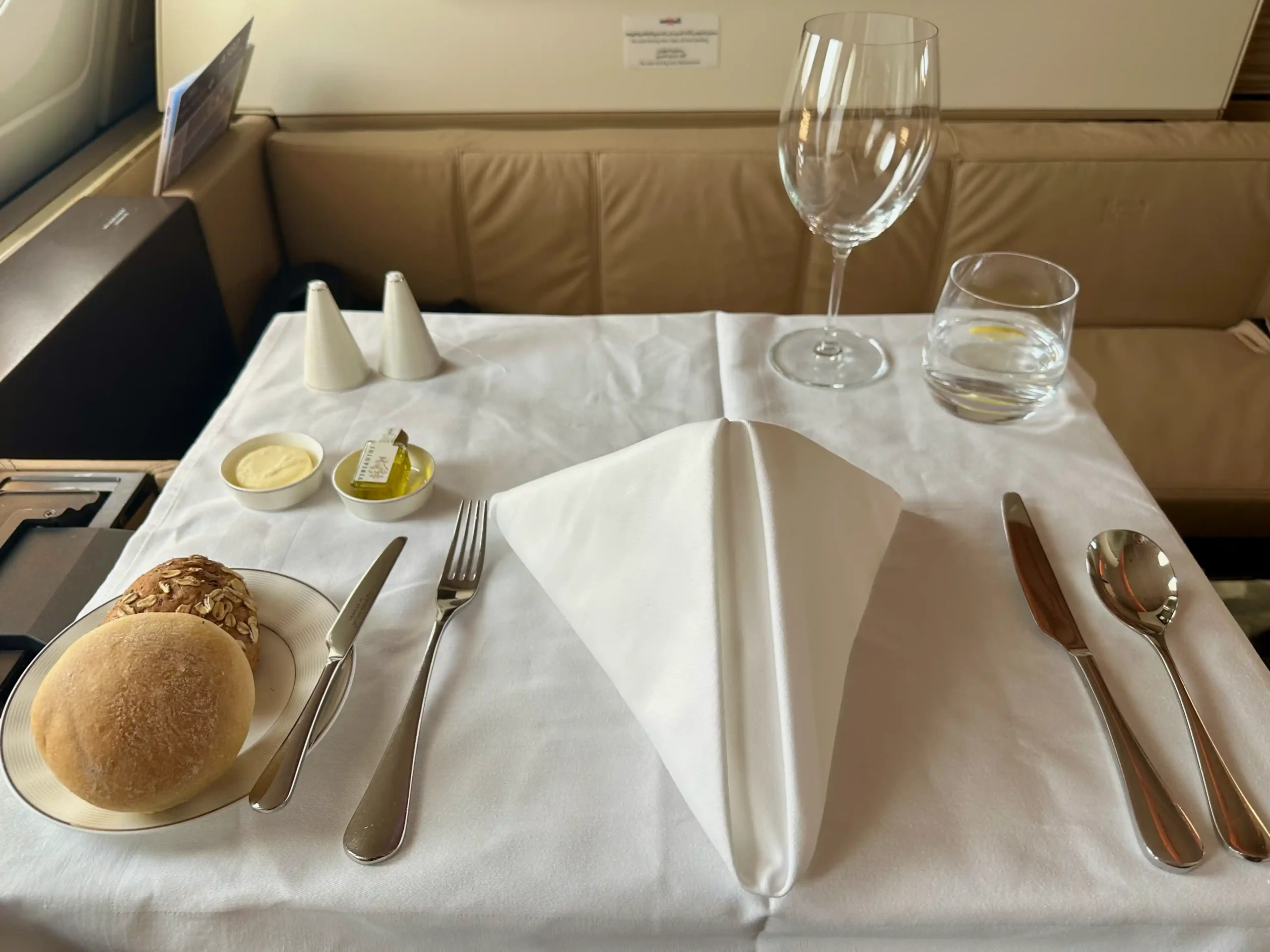 a table with a napkin and a plate of food