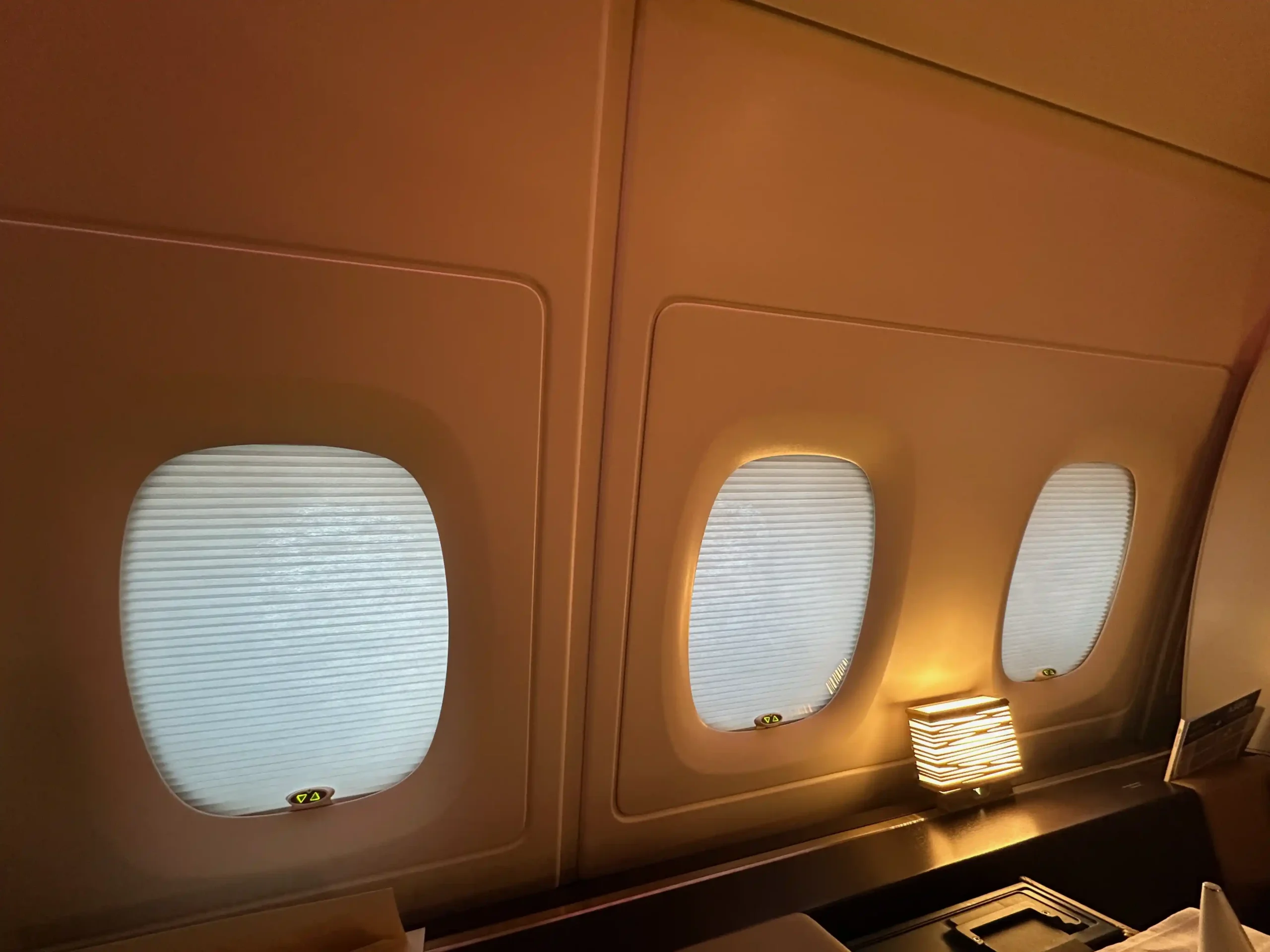 windows in an airplane with lights on