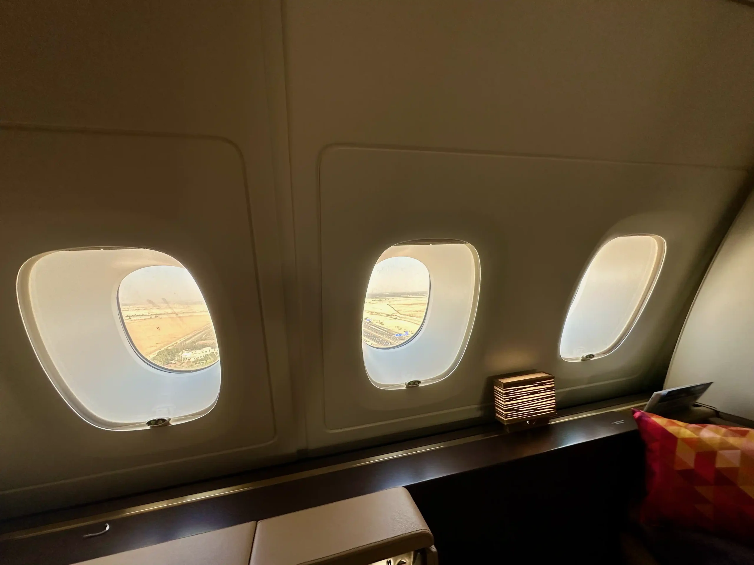 windows of an airplane with a window and a shelf